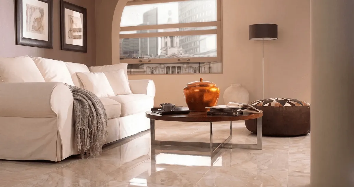 Modern living room with professionally installed marble flooring, a beige sofa, coffee table in Saint Louis, MO