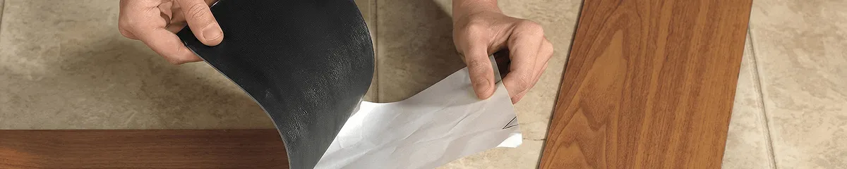 A professional installing vinyl flooring in Saint Louis, MO